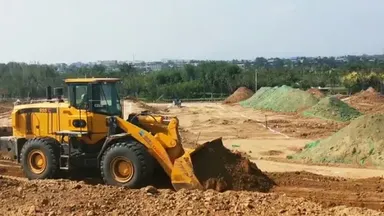 Фронтальный погрузчик ZL30H для планировки грунта